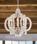 Farmhouse Style 5 Light Wood Chandelier Light Fixture For Kitchen Island Foyer Dining Room Living Room White Finish Cozy Rustic Pendant Lighting With Modern Vibe For Your Home, against a wooden beam ceiling.