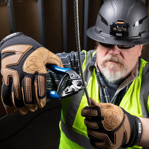Worker using Beefy Heavy Duty Cable Cutter for ACSR and Hardened Wire Center Cut Jaws Locking Handles during electrical installation.
