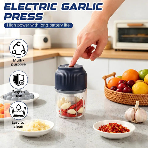 This Portable Cordless Electric Garlic Chopper Is A Mini Rechargeable Food Processor With Six Stainless Steel Blades on a kitchen counter.
