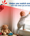 Wireless Indoor Motion Detector With Remote Control And Welcome Alarm Chime For Retail Shops, Offices, And Warehouses, Instant Entry Alerts When Customers Walk-In, Easy Setup, Battery Powered, Selectable Modes, Motion Sensor Alarm mounted on wall near child by window
