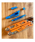 Modular Thumb Stud EDC Multitool Mod Kit with Signal Upgrade Compatibility for Dark Edition on wooden surface