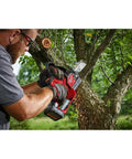 Cordless Pruning Saw 12V Six Inch Blade Model 2527-20 trimming tree branch, man using lightweight one hand tool outdoors