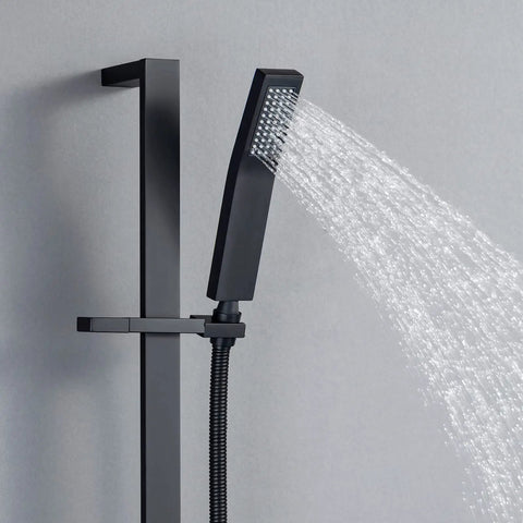 Brass Shower Slide Bar With Height And Angle Adjustable Handheld Shower Head Holder Wall Mount Bracket In Matte Black Finish Rustproof Durable Construction For Flexible Easy Reach Showering In Any Bathroom Up Your Shower Game. Mounted on a gray wall, showing water stream.