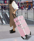 Woman at airport with 2 In 1 Rolling Makeup Case For Travel And Studio, Aluminum Frame Cosmetic Train Case, pink color, on wheels