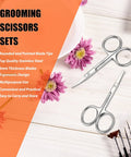 Facial Hair Scissors And Grooming Kit For Guys And Gals With Curved Safety Tip Clippers Two Pack Silver on table with flowers