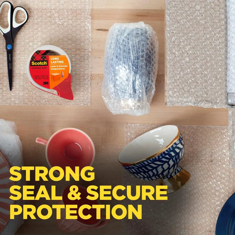 Heavy Duty Clear Packing Tape With Refillable Dispenser, Weather Tough And UV Resistant, Solvent Free Acrylic Adhesive on table with packaging items