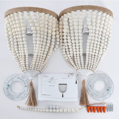 Bohemian Wood Beaded Wall Sconces Two Pack White Finish setup with parts and instructions on display
