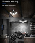 Two Pack LED Garage Lights 8000LM With 3 Plus 1 Deformable Panels 6500K Daylight Ceiling Bulbs illuminating a garage with motorcycle