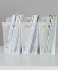 Three clear plastic storage containers with handles holding books on a shelf, part of a six-pack Narrow Shelf Bin With Handles, Clear Plastic Storage Container For Quick Easy Organizing On Shelves, Closets And Pantries, 6 Pack, Fits Standard Shelves, Measures 13 Inches Long, Five And Three Eighths Inches Wide, Nine And Three Quarters Inches High
