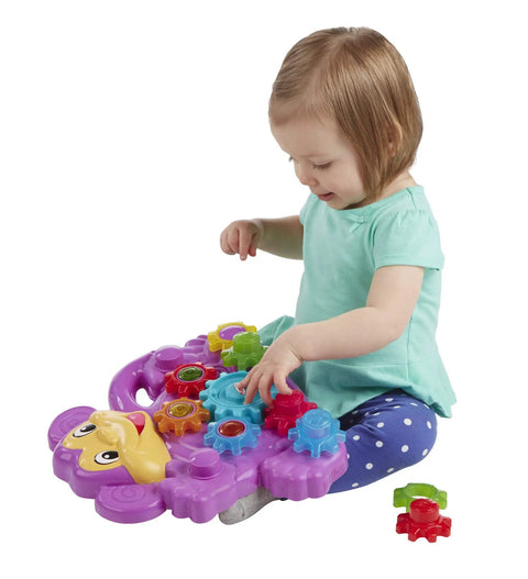 Child playing with Totally Awesome Dope Monkey Gears Stacking And Spinning Toy With Nine Interchangeable Plastic Cogs.