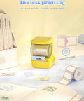 Hassle Free Bluetooth Label Maker With Straightforward Phone Sync And One Included Thermal Tape Roll Sweet For Quick Diy Crafting And Super Clean Home Tagging In Bright Yellow on desk with labels and notebook.