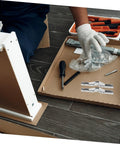 Installation of 4 Pack 90 Degree Folding Cabinet Door Hinges for Corner Cabinets with tools on a wooden floor