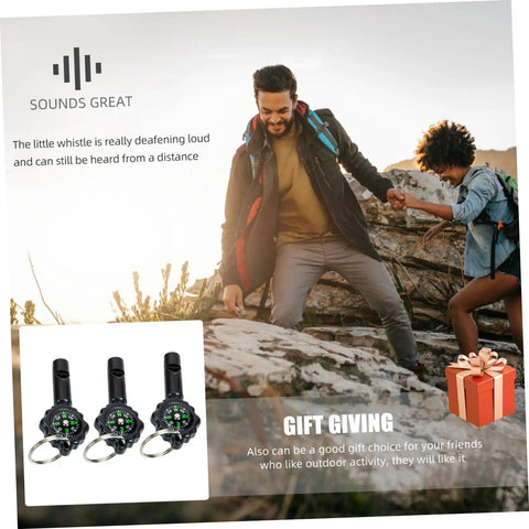 Three Pack Survival Whistles Keychain with Directional Indicator on a rock with two hikers in the background
