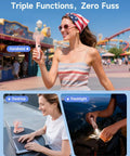 Woman using Portable Handheld Mini Fan With LED Display in an amusement park; USB rechargeable fan and flashlight for travel use.