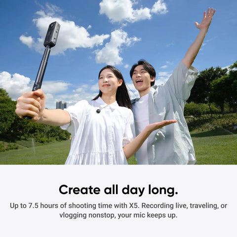 Two people using Wireless Mic Air Transmitter For Vlog And Streaming, Ultralight 7.9g, in a park setting while recording.