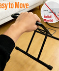 Easy to move Push In Floor Bike Stand For 16 To 29 Inch Bikes No Lift Needed shown being held indoors, highlighting portability.