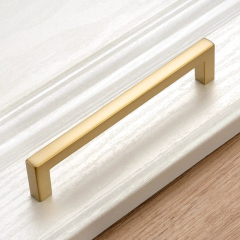Top Shelf 10 Pack Brushed Gold Cabinet Pulls 5 Inch Square Bar Drawer Handles on white cabinet surface.
