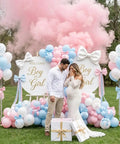 Pastel Pink and Blue Gender Reveal Balloons Set 60 Pack with couple revealing gender amidst pink smoke and decorated balloons display