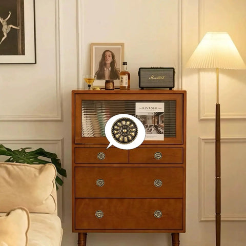 Eight Piece Vintage Antique Brass Knob Set With Flower Pattern For Cabinets, shown installed on a wooden drawer