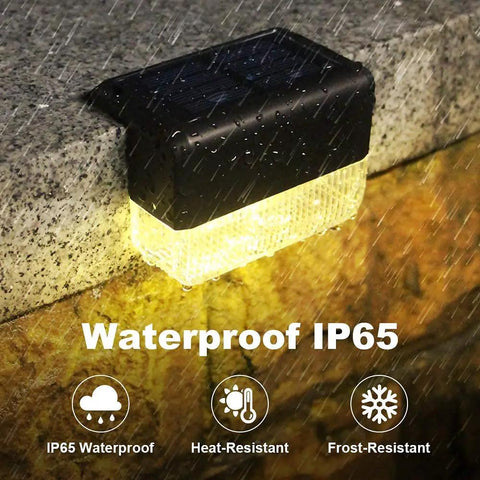 Solar Deck Lights 12 Pack Outdoor Waterproof LED Warm White and Color Changing on wet stone showing IP65 weatherproofing