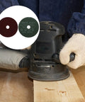 50Pcs Metal Grinding Disc Set Four Inch Red Alumina Abrasive Sheets For Aluminum And Wood in use on wood surface