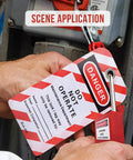 Worker attaching lock to equipment with Lockout Tagout Lock Box Kit With Ten Loto Locks, Portable Steel Safety Box for OSHA compliance.
