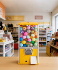 Candy Dispenser With 21 Inch Transparent Globe Holds 180 Balls, 25 Cent Coin Op For Malls And Parks on store counter