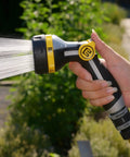 Relaxgrip Gardening Nozzle And Wash And Fill Set with No Squeeze Thumb Control spraying water in garden