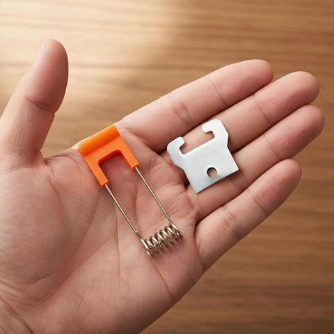 Hand holding Set Of 10 Recessed Lighting Spring Clips For Ceiling Canister Lights And LED Strip Mounting, 55x16mm