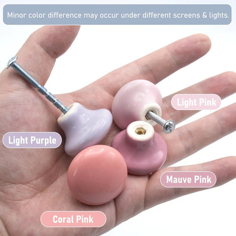 Upgrade Your Cabinets With This Sweet Set Of Sixteen Coral Pink Ceramic Cabinet Knobs Featuring Smooth Round Profiles No Sweat Installation And Top Shelf Hardware, showing various pink ceramic knobs in hand.