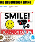 Legit Heavy Duty Aluminum Security Camera Signs Straight Up Warning To Scare Off Thieves Keep Your Home Yard Or Business Locked Down Bright Orange Black Cctv 4 Pack sign with smiley face and camera graphics.