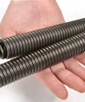 Premium Extension Springs With Dual Hooks Crafted From Rugged Stainless Steel shown in hand, ready for everyday car repairs and garage projects.