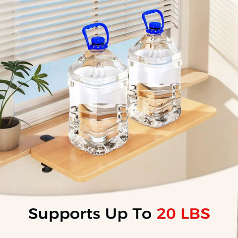 Fold Down Wall Mounted Desk Extender Tray And Side Table That Expands Your Space holding two large water jugs near a window
