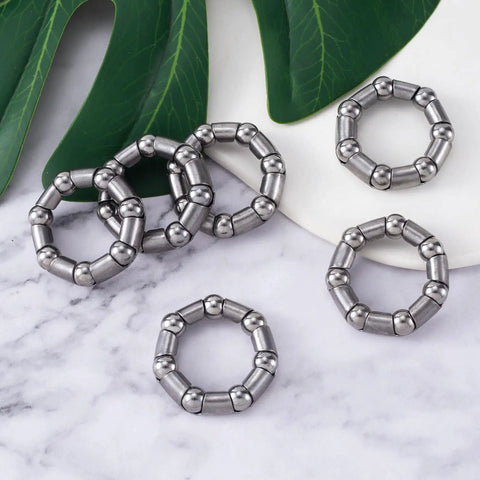 Six Pack Bicycle Crank Bearing Set 5/16 Inch 7 Balls 38 OD 24 ID 8 MM Ball Size on marble surface with leaves