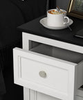 Open drawer with Brushed Nickel Cabinet Knobs 20 Pack Round Zinc Drawer Knobs For Kitchen Hardware Dressers And Closets With Ergonomic Rounded Design Easy Grab Durable Metal Build Non Sharp Edges Smooth Finish, next to coffee cup and smartphone on black surface.
