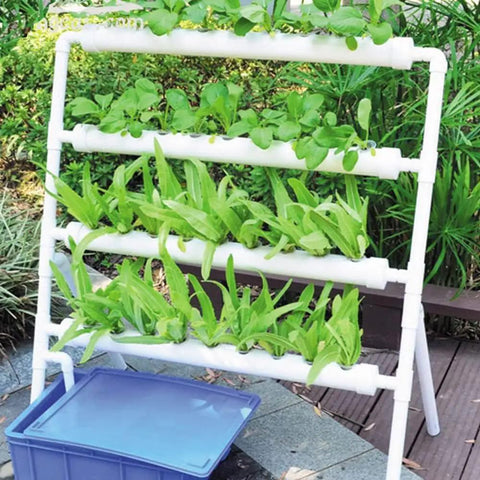 Vertical Grow Kit With 36 Sites For Leafy Greens, Four Layer PVC System with plants and water container outdoor view