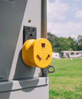 PowerGrip Heavy Duty RV 15 Amp Male To 30 Amp Female Electrical Adapter installed on outdoor socket