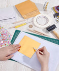 Metal Embossing Kit 51 Pcs for DIY Art Projects with Aluminum Foil Sheets 12x12cm and tools on a table