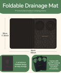 Front view of black foldable bar mat, 18x12 inches; left textured drying surface and right panel with bar-pattern icons.