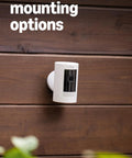 Outdoor Battery Security Camera Stick Up Cam With Live View And Color Night Vision Two Way Talk Motion Alerts Weather Resistant Alexa Compatible Easy Mount For Home Or Business White mounted on wooden exterior wall