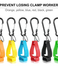 Six colorful glove clips with carabiners in orange, yellow, blue, red, black, and green for construction gear and helmets.