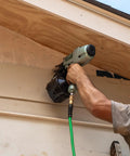 Person using Two And A Half Inch Coil Siding Nailer Pro Bundle With Bonus 18V Triple Hammer Impact Driver Kit on siding installation