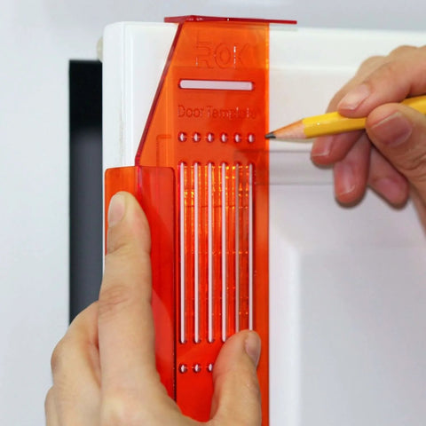 DIY Friendly No-Fuss All In One Cabinet Door And Drawer Drill Mounting Template in use on white cabinet for precise installation