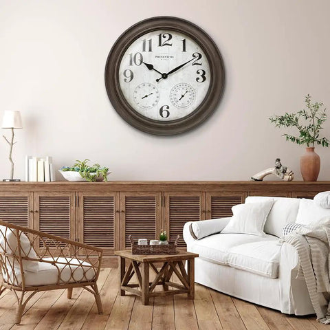 26 Inch Indoor And Outdoor Farmhouse Clock With Thermometer And Hygrometer All In One Weather Station Wall Art And Timepiece For Home Decor In Grey Oak Finish UV Resistant mounted on a wall in a living room setting.