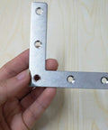12 Pack Stainless Steel L Shaped Corner Brackets Rock Solid Right Angle Furniture Repair Plates Heavy Duty Table Leg Supports With Screws in hand