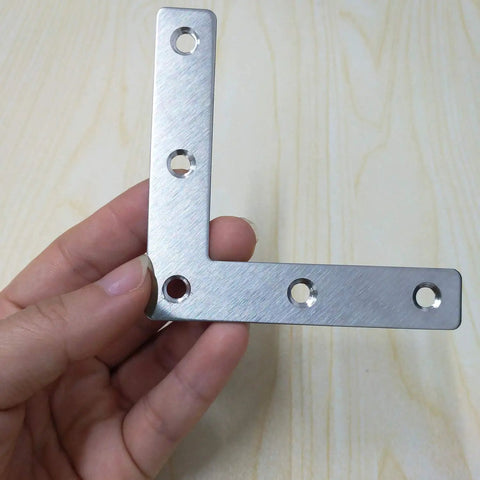 12 Pack Stainless Steel L Shaped Corner Brackets Rock Solid Right Angle Furniture Repair Plates Heavy Duty Table Leg Supports With Screws in hand
