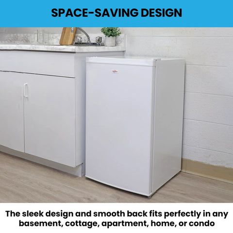 Hella Compact 3.1 Cubic Feet White Upright Freezer With Three Wire Baskets Garage Ready, positioned in a kitchen corner.