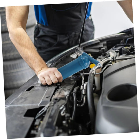 Mechanic using Portable 80cc Grease Gun With Precision Nozzle For Excavators, Cars, And Industrial Equipment in car engine bay