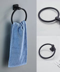 Matte Black 4 Piece Stainless Steel Bathroom Hardware Set wall mounted towel ring with blue towel.