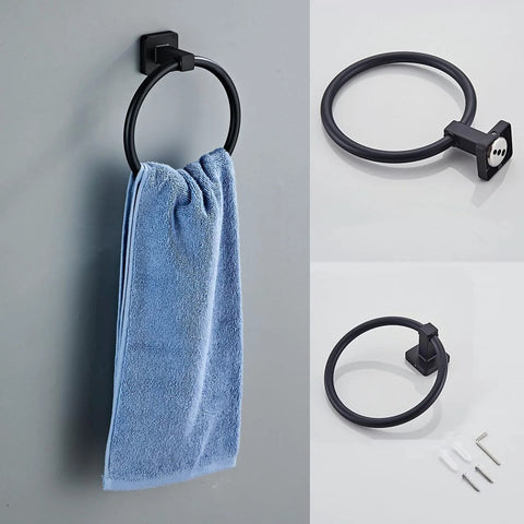 Matte Black 4 Piece Stainless Steel Bathroom Hardware Set wall mounted towel ring with blue towel.